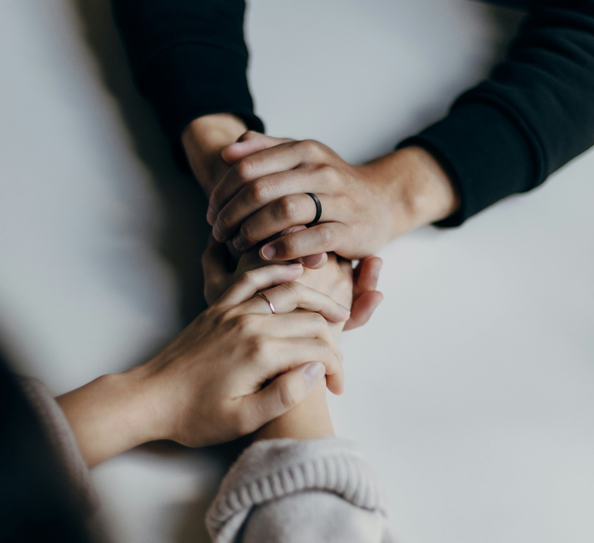 Supportive hands connecting in care